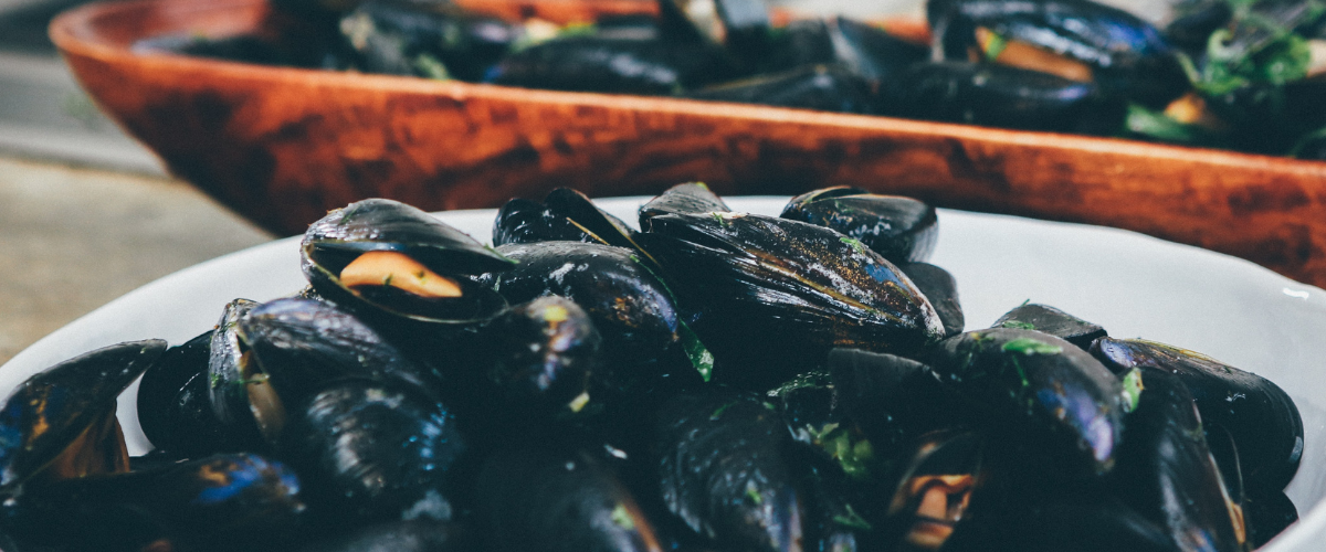 A bowl of mussels that have been picked from a local beach.