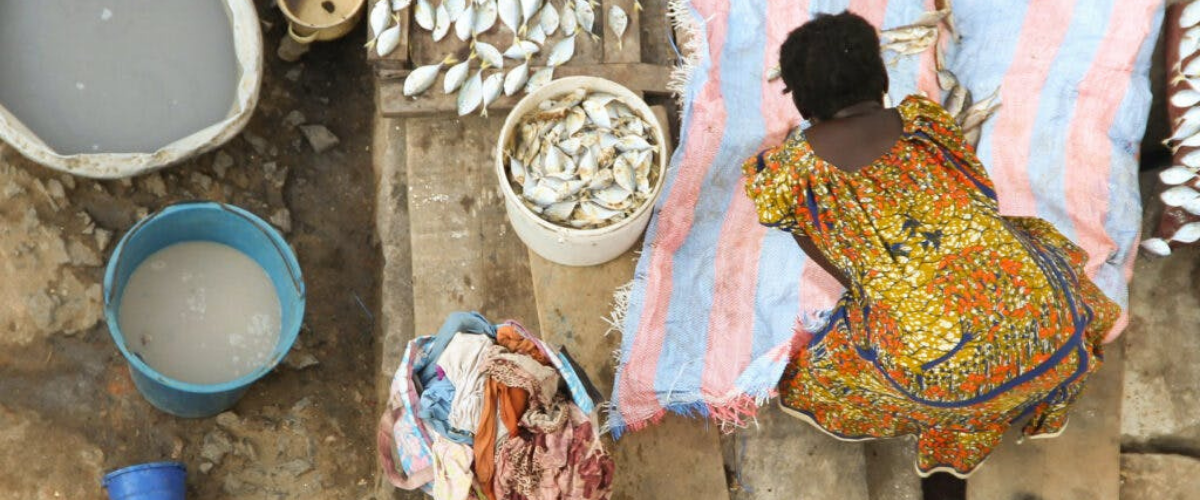 Woman sorting fish.
